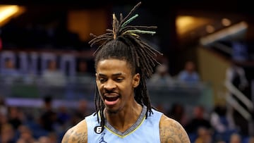 ORLANDO, FLORIDA - JANUARY 05: Ja Morant #12 of the Memphis Grizzlies reacts to a play during a game against the Orlando Magic at Amway Center on January 05, 2023 in Orlando, Florida. Mike Ehrmann/Getty Images/AFP NOTE TO USER: User expressly acknowledges and agrees that, by downloading and or using this photograph, User is consenting to the terms and conditions of the Getty Images License Agreement. (Photo by Mike Ehrmann / GETTY IMAGES NORTH AMERICA / Getty Images via AFP)