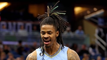 ORLANDO, FLORIDA - JANUARY 05: Ja Morant #12 of the Memphis Grizzlies reacts to a play during a game against the Orlando Magic at Amway Center on January 05, 2023 in Orlando, Florida.   Mike Ehrmann/Getty Images/AFP NOTE TO USER: User expressly acknowledges and agrees that, by downloading and or using this photograph, User is consenting to the terms and conditions of the Getty Images License Agreement. (Photo by Mike Ehrmann / GETTY IMAGES NORTH AMERICA / Getty Images via AFP)