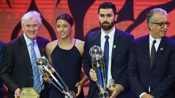 Asian Football Confederation Women's Player of the Year Samantha Kerr (2nd L) of Australia and Sky Blue FC, and Men's Player of the Year Omar Khrbin (2nd R) of Syria and Al-Hilal stand on the stage after receiving their awards at the AFC Annual