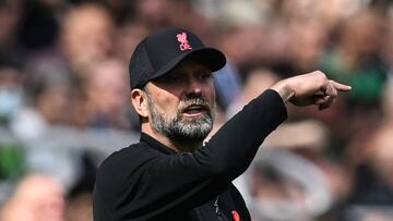 Liverpool's German manager Jurgen Klopp reacts during the English Premier League football match between Newcastle United and Liverpool at St James' Park in Newcastle-upon-Tyne, north east England on April 30, 2022. - RESTRICTED TO EDITORIAL USE. No use with unauthorized audio, video, data, fixture lists, club/league logos or 'live' services. Online in-match use limited to 120 images. An additional 40 images may be used in extra time. No video emulation. Social media in-match use limited to 120 images. An additional 40 images may be used in extra time. No use in betting publications, games or single club/league/player publications. (Photo by Paul ELLIS / AFP) / RESTRICTED TO EDITORIAL USE. No use with unauthorized audio, video, data, fixture lists, club/league logos or 'live' services. Online in-match use limited to 120 images. An additional 40 images may be used in extra time. No video emulation. Social media in-match use limited to 120 images. An additional 40 images may be used in extra time. No use in betting publications, games or single club/league/player publications. / RESTRICTED TO EDITORIAL USE. No use with unauthorized audio, video, data, fixture lists, club/league logos or 'live' services. Online in-match use limited to 120 images. An additional 40 images may be used in extra time. No video emulation. Social media in-match use limited to 120 images. An additional 40 images may be used in extra time. No use in betting publications, games or single club/league/player publications. (Photo by PAUL ELLIS/AFP via Getty Images)