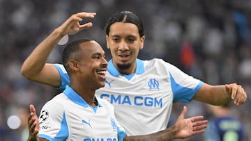 Marseille's Brazilian forward #14 Igor Paixao (L) celebrates scoring his team's first goal with Marseille's French midfielder #26 Bilal Nadir during the UEFA Champions League, league phase day 2, football match between Olympique de Marseille (FRA) and AFC Ajax (NED) at the Velodrome stadium, in Marseille on September 30, 2025. (Photo by Christophe Simon / AFP)