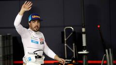 FILE PHOTO: McLaren driver Fernando Alonso of Spain waves to spectators in the pit during the qualifying session at the Yas Marina racetrack in Abu Dhabi, United Arab Emirates November 24, 2018. Luca Bruno/ Pool via REUTERS/File Photo