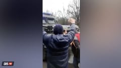 Unarmed Ukrainian civilians form human barrier to stop Russian troops