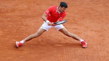 Serbia's Novak Djokovic plays a return during his second round singles match against Italy's Jannik Sinner on day five of the Monte-Carlo ATP Masters Series tournament in Monaco on April 14, 2021. (Photo by Valery HACHE / AFP)