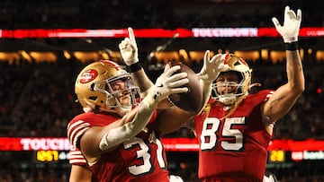 Oct 27, 2024; Santa Clara, California, USA; San Francisco 49ers running back Isaac Guerendo (31) celebrates with San Francisco 49ers tight end George Kittle (85) after scoring a touchdown against the Dallas Cowboys during the third quarter at Levi's Stadium. Mandatory Credit: Kelley L Cox-Imagn Images