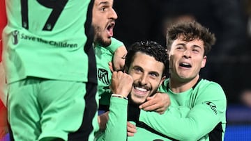 Atletico Madrid's Spanish defender #22 Mario Hermoso (C) celebrates with teammates after scoring his team's second goal during the UEFA Champions League Group E football match between Feyenoord and Atletico Madrid at the De Kuip Stadium in Rotterdam on November 28, 2023. (Photo by JOHN THYS / AFP)