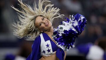 The Dallas Cowboys Cheerleaders perform during the second half of a NFL preseason football game at AT&amp;T Stadium. 