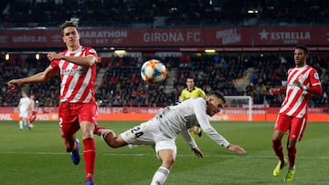 Girona's Colombian defender Bernardo Espinosa (L) and Girona's Spanish defender Jonas Ramalho (R) challenge Real Madrid's Spanish midfielder Daniel Ceballos (C) during the Spanish Copa del Rey (King's Cup) quarter-final second leg foot