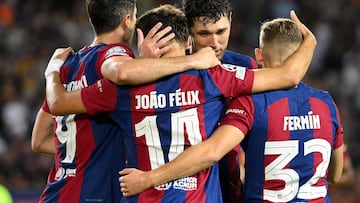 Barcelona's Portuguese forward #14 Joao Felix celebrates with teammates after scoring his team's fifth goal during the UEFA Champions League 1st round day 1 Group H football match between FC Barcelona and Royal Antwerp FC at the Estadi Olimpic Lluis Companys in Barcelona on September 19, 2023. (Photo by Josep LAGO / AFP)