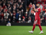 Liverpool's Egyptian forward #11 Mohamed Salah applauds as he leaves the pitch after being substituted during the UEFA Champions League, round of 16 second leg football match between Liverpool and Galatasaray at Anfield in Liverpool, north-west England on March 18, 2026. (Photo by Paul ELLIS / AFP)