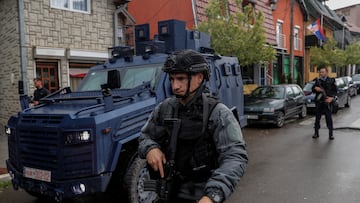 A special police forces officer stands next to an armoured vehicle, following clashes between Kosovo police and ethnic Serb protesters, who tried to prevent a newly-elected ethnic Albanian mayor from entering his office, in the town of Zvecan, Kosovo, May 26, 2023. REUTERS/Valdrin Xhemaj NO RESALES. NO ARCHIVES.