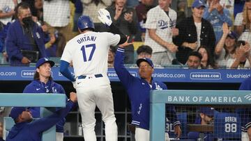 Sep 25, 2024; Los Angeles, California, USA; Los Angeles Dodgers designated hitter Shohei Ohtani (17) is greeted by manager Dave Roberts (30) after scoring a run in the first inning against the San Diego Padres at Dodger Stadium. Mandatory Credit: Kirby Lee-Imagn Images