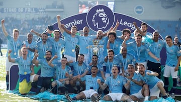 FILE PHOTO: Soccer Football - Premier League - Brighton & Hove Albion v Manchester City - The American Express Community Stadium, Brighton, Britain - May 12, 2019 Manchester City players pose with the trophy as they celebrate winning the Premier Leag
