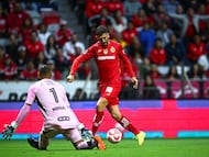 Joao Dias scores his goal 0-1 of Toluca to Nahuel Guzman of Tigres during the 3rd round match between Toluca and Tigres UANL as part of the Liga BBVA MX, Torneo Apertura 2025 at Nemesio Diez Stadium, on July 26, 2025 in Toluca, Estadio de Mexico, Mexico.