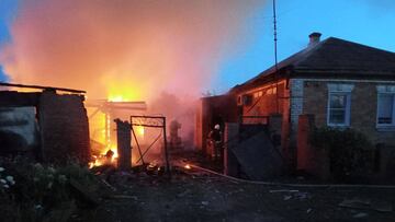 Firefighters work at a house on fire following a shelling, which, according to the regional governor, was by Ukrainian forces, in the village of Sobolevka, Belgorod region, Russia, in this handout image released June 2, 2023. Governor of Russia's Belgorod Region Vyacheslav Gladkov via Telegram/Handout via REUTERS ATTENTION EDITORS - THIS IMAGE HAS BEEN SUPPLIED BY A THIRD PARTY. NO RESALES. NO ARCHIVES.