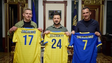 This handout photograph released by United24 on July 26, 2023, shows Ukranian international footballer Alex Zinchenko (L) and former Ukrainian international footballer Andriy Shevchenko (R) as they pose with Ukranian President Volodymyr Zelensky (C) in Kyiv on May 30, 2023. Arsenal defender Oleksandr Zinchenko says he only had to look into the eyes of Ukrainian children who lived under Russian occupation in a village to find the motivation to raise money to rebuild their school. Zinchenko and Shevchenko have combined with the charity United24 to organise an all star match at one of the latter's former clubs Chelsea's Stamford Bridge on August 5, to raise funds for the reconstruction of a damaged school in Mykhailo-Kotsyubinsk. (Photo by Handout / UNITED24 / AFP) / RESTRICTED TO EDITORIAL USE - MANDATORY CREDIT "AFP PHOTO/UNITED24 " - NO MARKETING NO ADVERTISING CAMPAIGNS - DISTRIBUTED AS A SERVICE TO CLIENTS