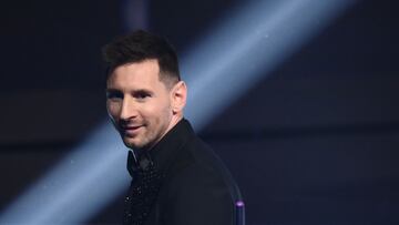 Argentina and Paris Saint-Germain forward Lionel Messi poses on stage after receiving the Best FIFA Men?s Player award during the Best FIFA Football Awards 2022 ceremony in Paris on February 27, 2023. (Photo by FRANCK FIFE / AFP)