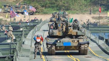 YEOJU, SOUTH KOREA - 2022/10/19: South Korean Army K-2 tanks cross a floating bridge during a South Korea-US joint river-crossing drill as part of the annual Hoguk military exercise in Yeoju. North Korea's military warned South Korea to halt what it calls "provocations in frontline areas," having again fired hundreds of artillery shots into maritime buffer zones near their border in response to field drills under way in the South. (Photo by KIM Jae-Hwan/SOPA Images/LightRocket via Getty Images)