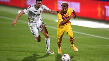 BARCELONA, SPAIN - SEPTEMBER 12: Konrad de la Fuente of FC Barcelona is challenged by Carlos Albarran of Gimnastic de Tarragona during the during the pre-season friendly match between FC Barcelona and Gimnastic de Tarragona at Estadi Johan Cruyff on Septe