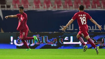 Qatar&#039;s Akram Afif (L) celebrates after scoring a goal during the 2017 Gulf Cup of Nations football match between Qatar and Yemen at the Sheikh Jaber al-Ahmad Stadium in Kuwait City on December 23, 2017. / AFP PHOTO / GIUSEPPE CACACE