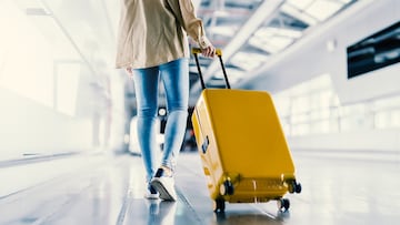 International airport terminal. Asian beautiful woman with luggage and walking in airport