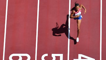 (FILES) An overview shows USA's Allyson Felix as she runs to first place in the women's 400m heats during the Tokyo 2020 Olympic Games at the Olympic Stadium in Tokyo on August 3, 2021. The grande dame of American track and field is the only woman to have won seven Olympic golds. With 11 medals she is also the most-decorated track and field athlete. (Photo by Antonin THUILLIER / AFP)