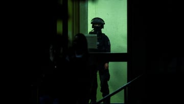 A police officer stands inside a building, following an incident in which several individuals were killed after a man randomly stabbed passers-by with a knife at a city festival, in Solingen, Germany, August 24, 2024. REUTERS/Thilo Schmuelgen