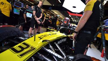 French Formula One driver Esteban Ocon enters his car during a test day at the Yas Marina Circuit in Abu Dhabi, on December 3, 2019. - The highly-rated 23-year-old Frenchman will race for Renault next year as successor to Nico Hulkenberg alongside Daniel