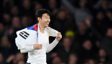Heung-Min Son of Tottenham Hotspur holds a South-Korean flag after the Carabao Cup Quarter Final match between Arsenal and Tottenham Hotspur at Emirates Stadium on December 19