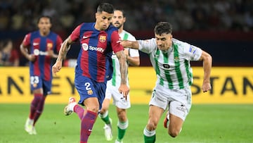 Barcelona's Portuguese defender #02 Joao Cancelo fights for the ball with Real Betis' Spanish midfielder #21 Marc Roca during the Spanish Liga football match between FC Barcelona and Real Betis at the Estadi Olimpic Lluis Companys in Barcelona on September 16, 2023. (Photo by Josep LAGO / AFP)