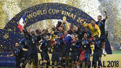(FILES) In this file photo taken on July 15, 2018 France's players hold their World Cup trophy as they celebrate their win during the trophy ceremony at the end of the Russia 2018 World Cup final football match between France and Croatia at the Luzhniki Stadium in Moscow on July 15, 2018. - France's football players are awarded Chevalier of the Legion of Honour (Legion d'honneur) on January 1, 2019. (Photo by FRANCK FIFE / AFP) / RESTRICTED TO EDITORIAL USE - NO MOBILE PUSH ALERTS/DOWNLOADS