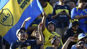 Boca Juniors supporters cheer for their team during their Supercopa Argentina 2018 final football match against River Plate at Malvinas Argentinas stadium in Mendoza, Argentina, on March 14, 2018. / AFP PHOTO / Andres Larrovere