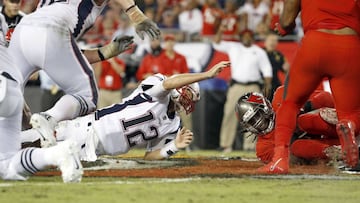Oct 5, 2017; Tampa, FL, USA; New England Patriots quarterback Tom Brady (12) loses the ball as Tampa Bay Buccaneers defensive end Will Clarke (94) recovers the fumble during the second half at Raymond James Stadium. Mandatory Credit: Kim Klement-USA TODAY Sports