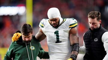 Dec 14, 2025; Denver, Colorado, USA; Green Bay Packers defensive end Micah Parsons (1) walks off the field with help from medical personnel following an injury during the third quarter against the Denver Broncos at Empower Field at Mile High. Mandatory Credit: Ron Chenoy-Imagn Images TPX IMAGES OF THE DAY