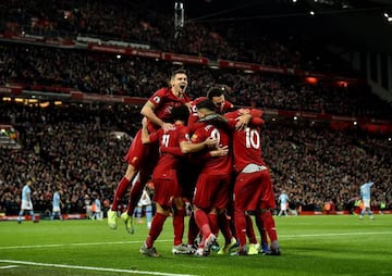 Liverpool's players celebrate their opening goal in Sunday's Premier League win over Manchester City.