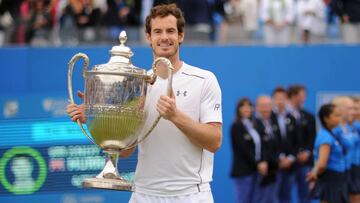 Queens Club, London - 19/6/16. Great Britain's Andy Murray celebrates with the trophy after victory in the final.