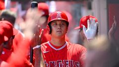 ANAHEIM, CA - APRIL 23: Shohei Ohtani #17 of the Los Angeles Angels is greeted in the dugout after hitting a sacrifice fly to score a run in the first inning against the Kansas City Royals at Angel Stadium of Anaheim on April 23, 2023 in Anaheim, California.   Jayne Kamin-Oncea/Getty Images/AFP (Photo by Jayne Kamin-Oncea / GETTY IMAGES NORTH AMERICA / Getty Images via AFP)
