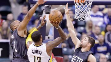 INDIANAPOLIS, IN - JANUARY 05: Paul George #13 of the Indiana Pacers shoots the ball while defended by Randy Foye #2 and Joe Harris #12 of the Brooklyn Nets at Bankers Life Fieldhouse on January 5, 2017 in Indianapolis, Indiana. NOTE TO USER: User expressly acknowledges and agrees that, by downloading and or using this photograph, User is consenting to the terms and conditions of the Getty Images License Agreement Andy Lyons/Getty Images/AFP
== FOR NEWSPAPERS, INTERNET, TELCOS & TELEVISION USE ONLY ==
