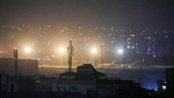 Planes are seen on the tarmac at the airport in Kabul late on August 30, 2021, hours ahead of a US deadline to complete its frenzied withdrawal from Afghanistan. 