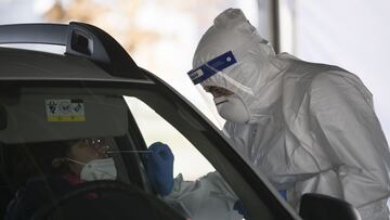 TURIN, ITALY - NOVEMBER 19: An Italian military nurse swabs a woman on the New Drive In Covid-19 PCR Test Facility of Esercito Italiano at Juventus Allianz Stadium on November 19, 2020 in Turin, Italy.
 Italy has recorded over 1 million cases of the coron