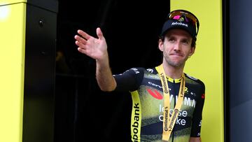 Cycling - Tour de France - Stage 10 - Ennezat to Mont-Dore - Ennezat, France - July 14, 2025 Team Visma | Lease a Bike's Simon Yates celebrates on the podium after winning stage 10 REUTERS/Sarah Meyssonnier
