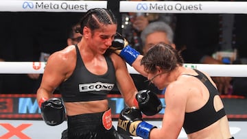 ARLINGTON, TEXAS - NOVEMBER 15: Katie Taylor (R) punches Amanda Serrano during their undisputed women's super lightweight title bout at AT&T Stadium on November 15, 2024 in Arlington, Texas. Christian Petersen/Getty Images/AFP (Photo by Christian Petersen / GETTY IMAGES NORTH AMERICA / Getty Images via AFP)