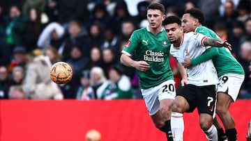 Plymouth's English defender #29 Matthew Sorinola (R) holds back Liverpool's Colombian midfielder #07 Luis Diaz during the English FA Cup fourth round football match between Plymouth Argyle and Liverpool at Home Park in Plymouth, south west England, on February 9, 2025. (Photo by HENRY NICHOLLS / AFP) / RESTRICTED TO EDITORIAL USE. No use with unauthorized audio, video, data, fixture lists, club/league logos or 'live' services. Online in-match use limited to 120 images. An additional 40 images may be used in extra time. No video emulation. Social media in-match use limited to 120 images. An additional 40 images may be used in extra time. No use in betting publications, games or single club/league/player publications. /