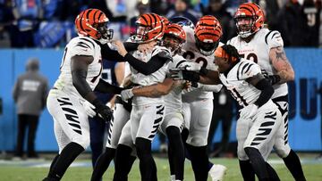 Jan 22, 2022; Nashville, Tennessee, USA; Cincinnati Bengals kicker Evan McPherson (2) is mobbed by teammates after kicking the game-winning 52-yard field goal as time expires during the AFC Divisional playoff football game against the Tennessee Titans at 