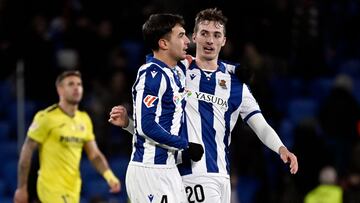 Real Sociedad's Spanish midfielder #04 Martin Zubimendi and Real Sociedad's Spanish defender #20 Jon Pacheco celebrate their victory at the end of the Spanish league football match between Real Sociedad and Villarreal CF at the Anoeta stadium in San Sebastian on January 13, 2025. (Photo by ANDER GILLENEA / AFP)