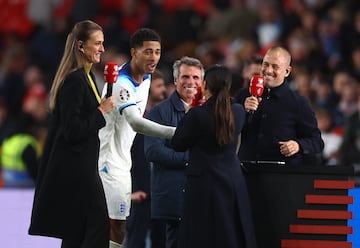 England's Jude Bellingham with TV pundits Jill Scott, Gianfranco Zola and Joe Cole after qualifying for Euro 2024.