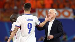 France's head coach Didier Deschamps (R) taps hands with France's forward #09 Olivier Giroud after a draw in the UEFA Euro 2024 Group D football match between the Netherlands and France at the Leipzig Stadium in Leipzig on June 21, 2024. (Photo by FRANCK FIFE / AFP)