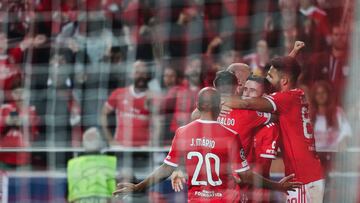 Benfica's Portuguese midfielder Rafa Silva celebrates with teammates after scoring his team's fourth goal during the UEFA Champions League 1st round day 5, Group H football match between SL Benfica and Juventus at the Luz stadium in Lisbon on October 25, 2022. (Photo by CARLOS COSTA / AFP)