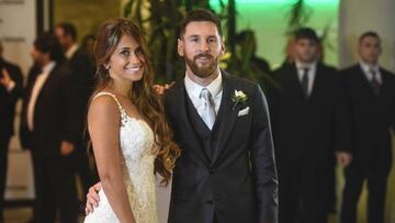 Argentine football star Lionel Messi and bride Antonella Roccuzzo pose for photographers just after their wedding at the City Centre Complex in Rosario, Santa Fe province, Argentina on June 30, 2017.
