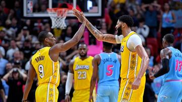 Dec 13, 2019; Miami, FL, USA; Los Angeles Lakers forward Anthony Davis (right) greets Lakers guard Rajon Rondo (left) during the second half against the Miami Heat at American Airlines Arena. Mandatory Credit: Steve Mitchell-USA TODAY Sports